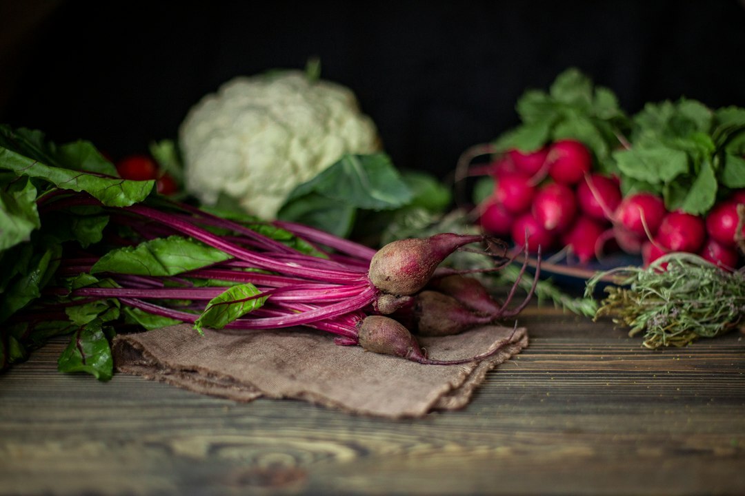 Fresh spring vegetables and herbs on a wooden table