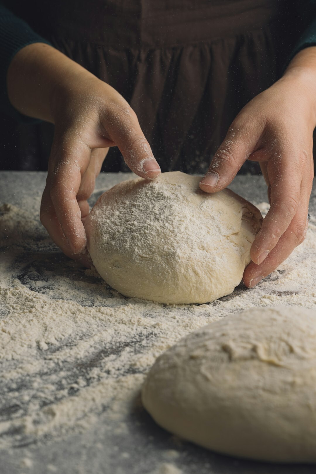 woman kneading dough